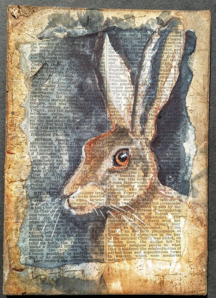 The head and shoulders of a Brown Hare painted onto a page of text which shows through the paint. He is facing left but his eye is on the viewer.