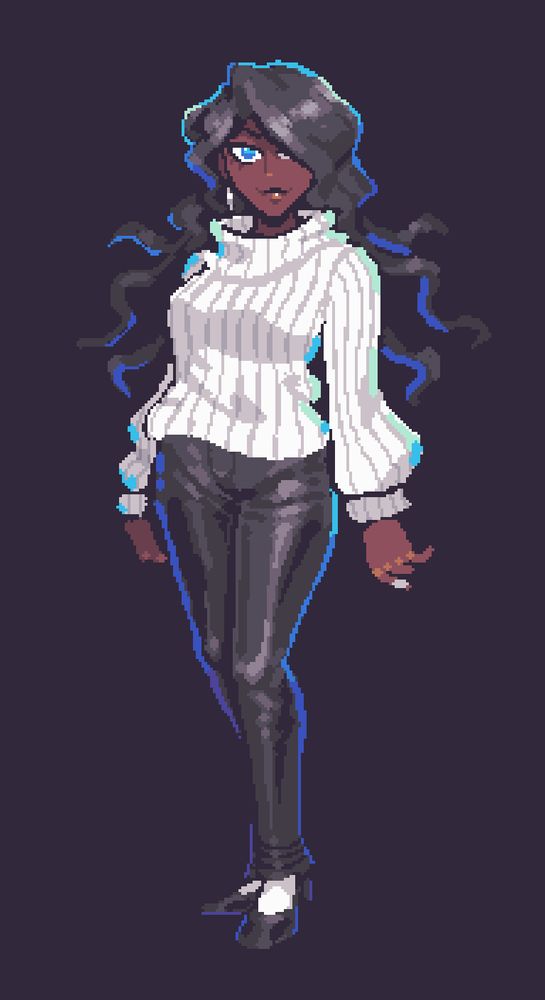 A thin, dark skinned woman with long, wavy black hair and blue eyes. She is wearing a loose white sweater with vertical lines and leather pants, and white socks and black loafers. She has a ring on her left index finger and white earrings.