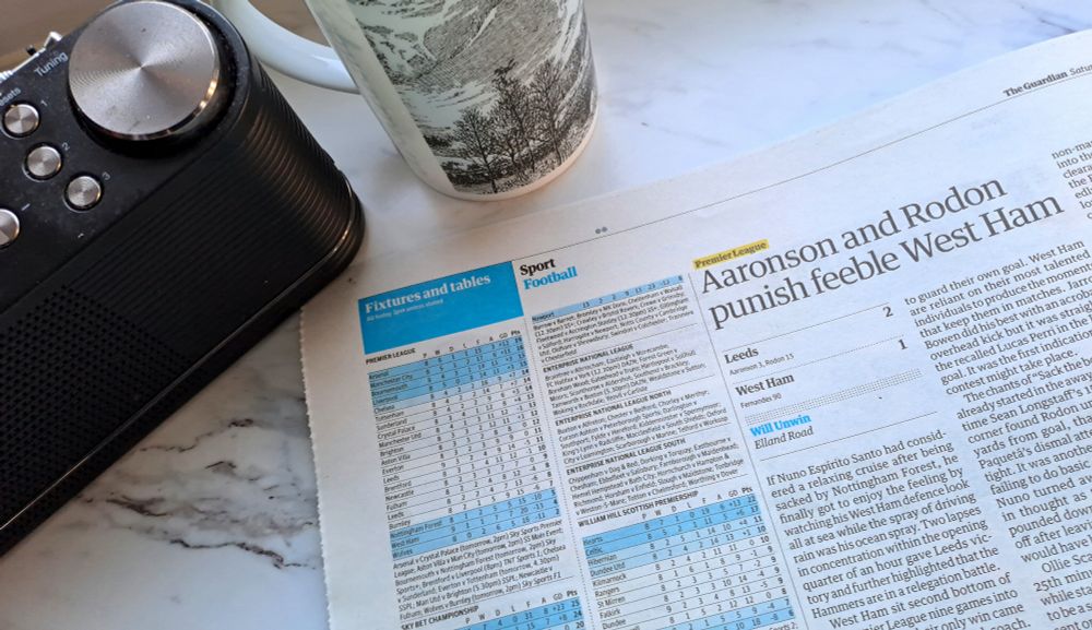  Newspaper with story 'Aaronson and Rodon punish feeble West Ham' and league table alongside