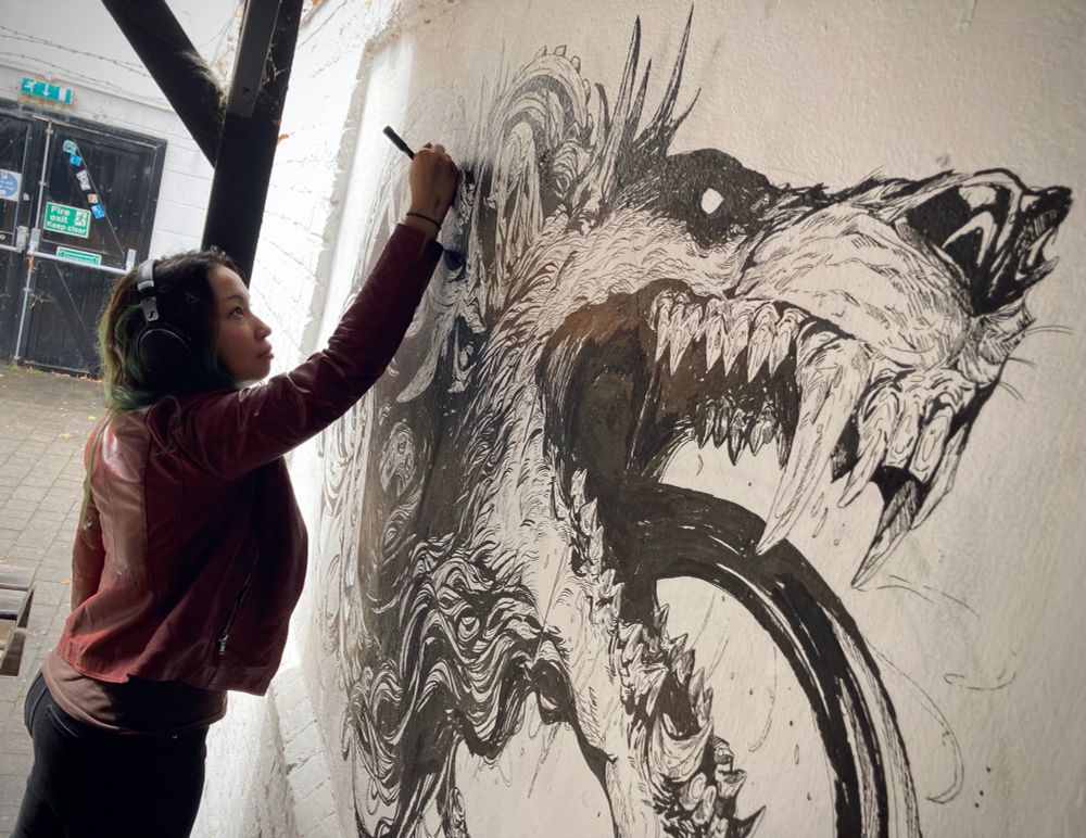 Me drawing a wolf monster on a wall 