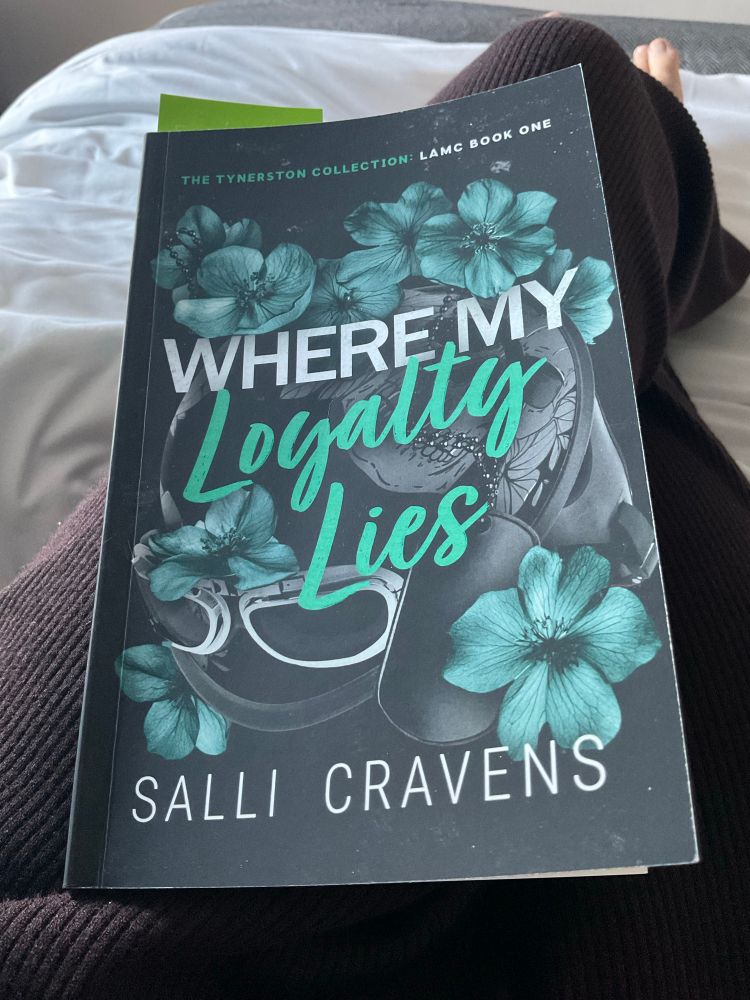 Book on my lap ‘Where my loyalty lies’ by Salli Cravens