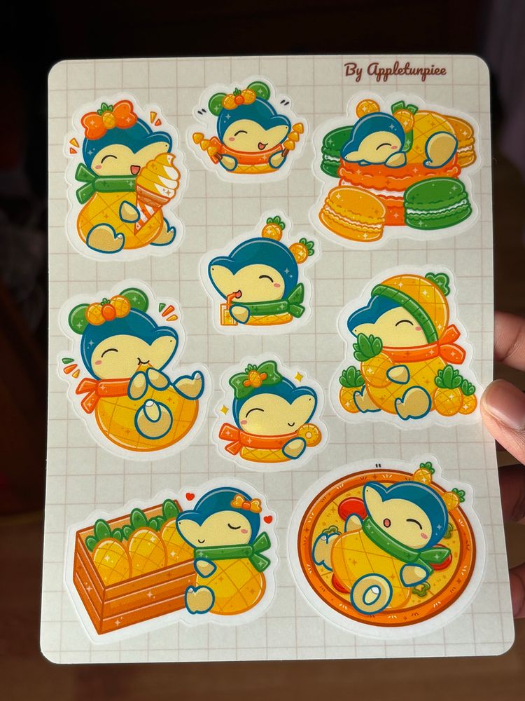 Sticker sheet of Cyndaquil wearing a pineapple outfit