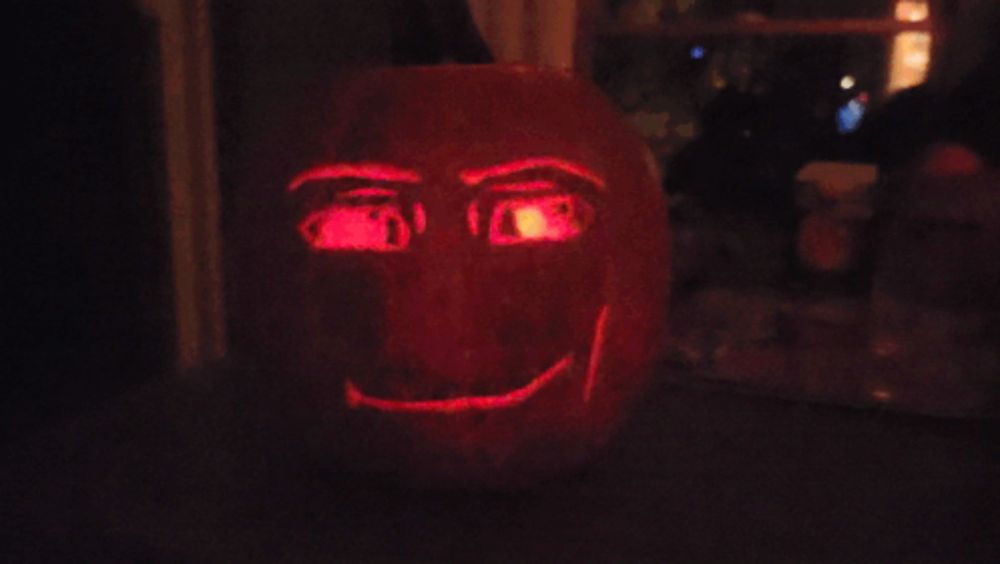 a pumpkin with a face carved into it