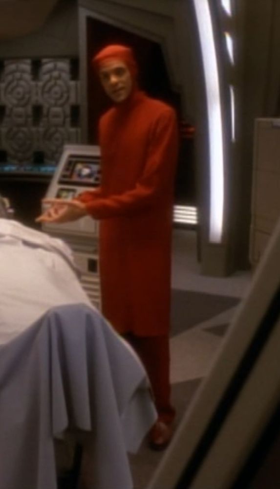 julian bashir of star trek fame in really insane fully red surgical scrubs