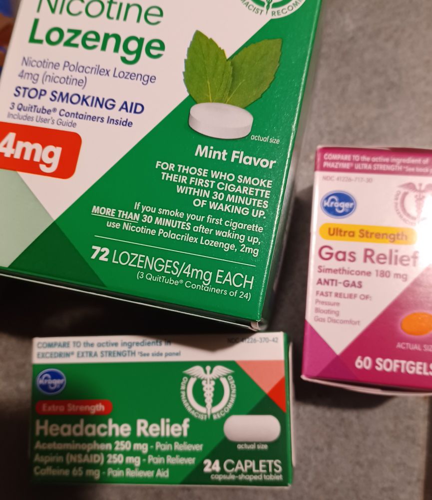 slightly blurry photo of 4mg nicotine lozenges, tension headache medicine & gas relief pills. this was my kroger haul for today and just lol i am 39 going on 80