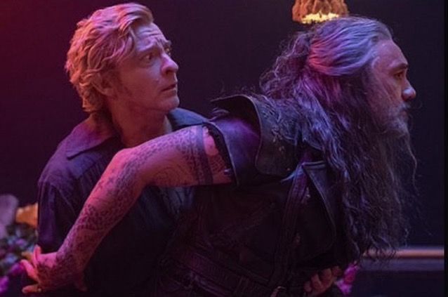 image from ofmd ‘calypso’s birthday’ where ed is pushing stede behind him and stede is holding ed’s chest. it looks especially compromising at this angle