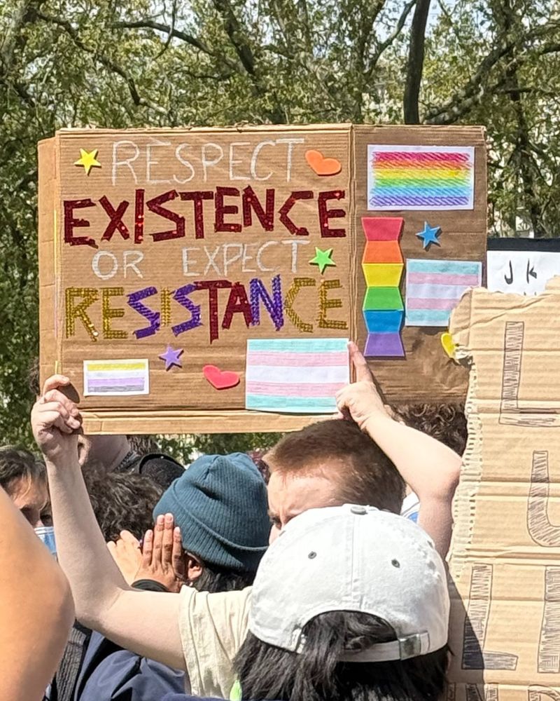 Someone holding a sign saying: Respect existence or expect resistance. 