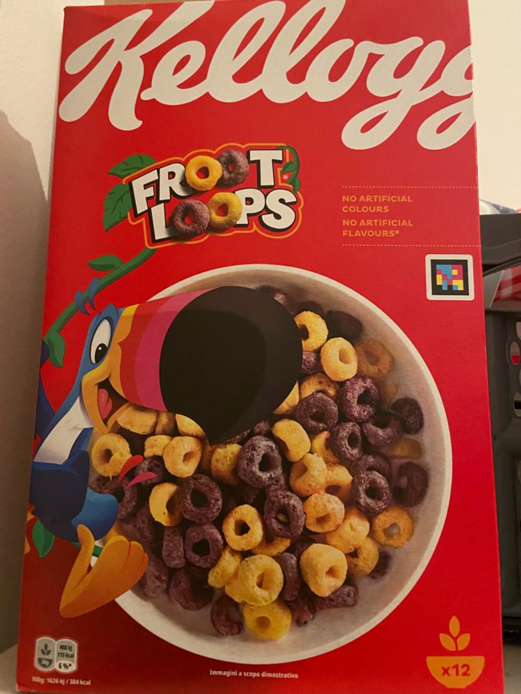 A box of Froot Loops with yellow and purple cereal pictured, there is text reading “no artificial colours no artificial flavours”