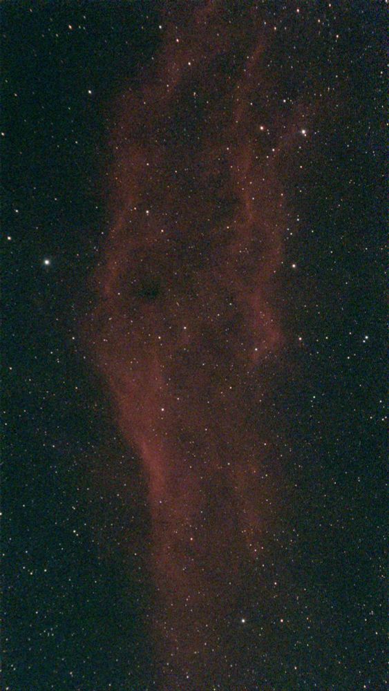 The molecular hydrogen of the California Nebula glows red in this stacked image.