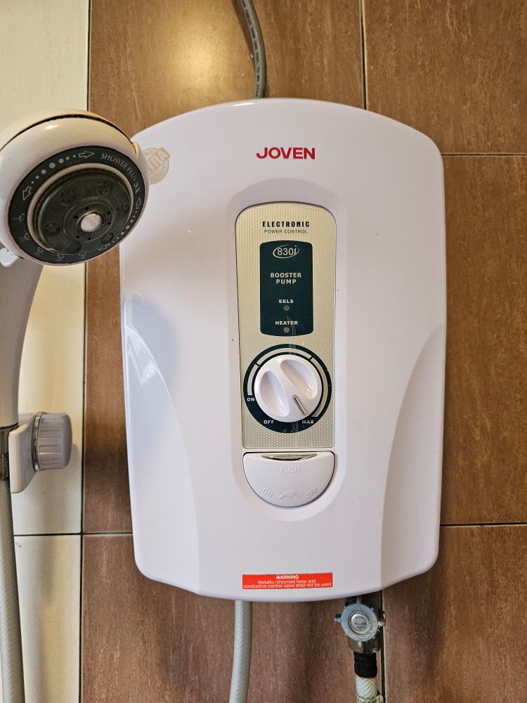A shower unit with lights for 'heater' but also 'eels'