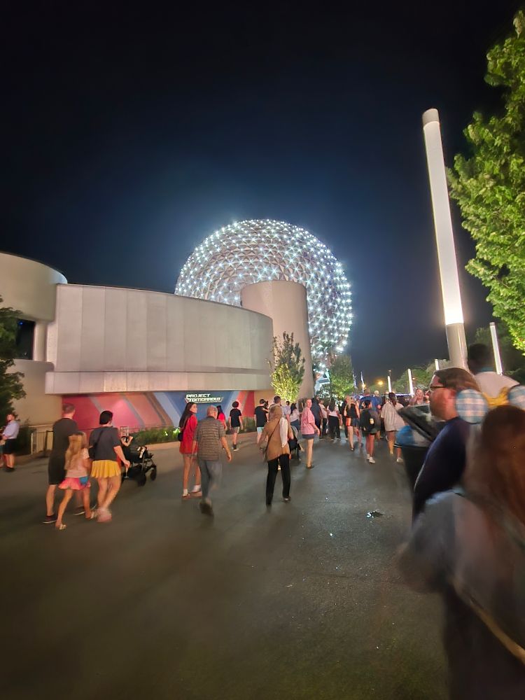 A picture of the Epcot globe lit up at night.