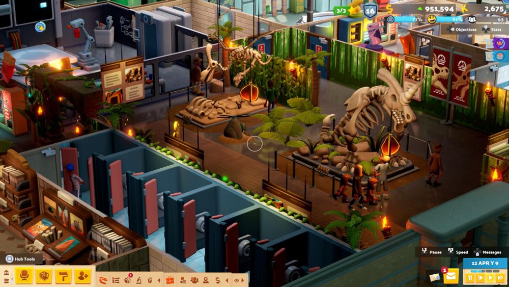 A closer shot of two pristine dinosaur exhibits in Two Point Museum, with a beautiful row of toilets in the foreground 