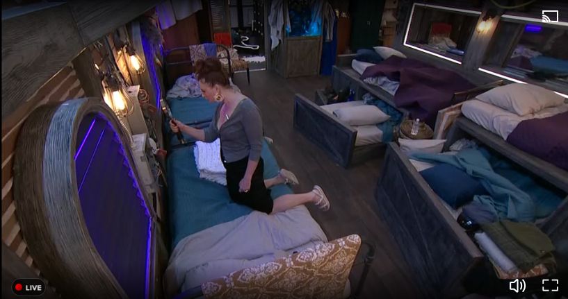 Rachel Reilly searching the bedroom for clues during Big Brother 27's live feeds