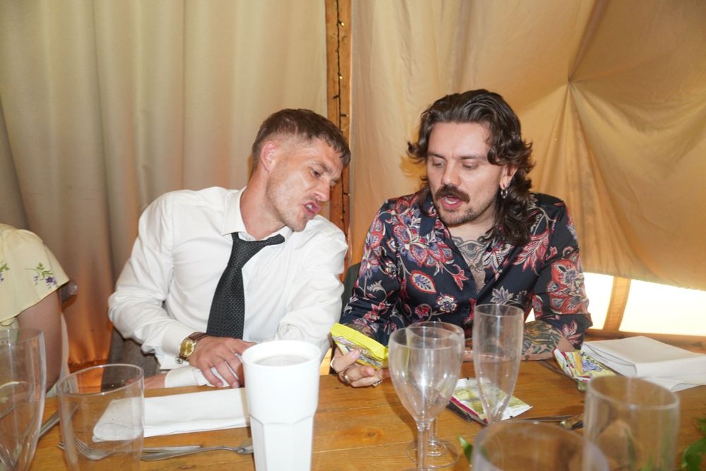 my friend and I arguing while looking at a small yellow packet of scampi fries
