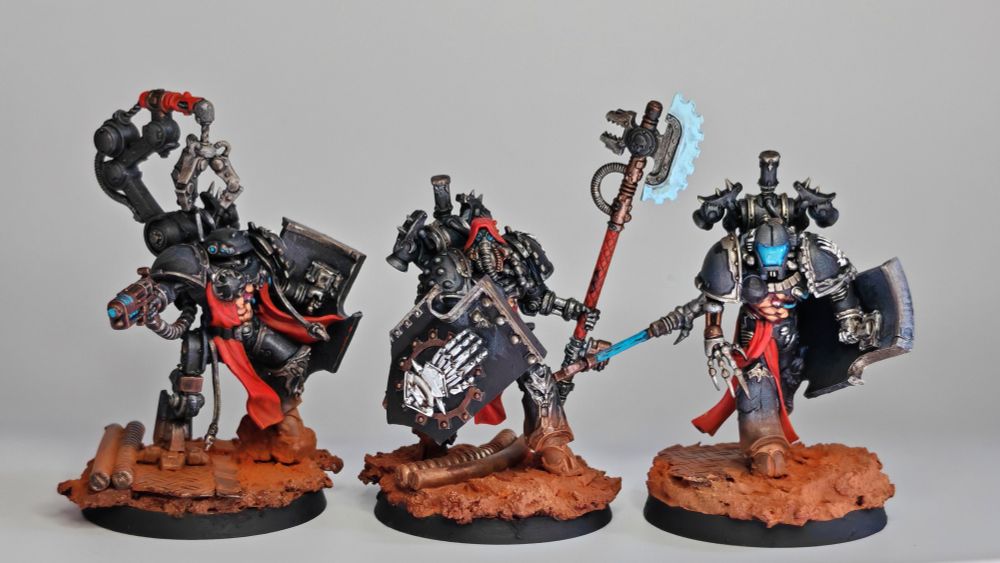three corrupted iron hands bladeguard veterans featuring heavy augmetics and exposed flesh