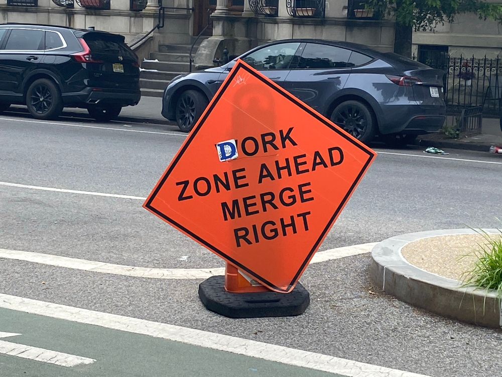 A “Work Zone Ahead” sign, but the first letter has been altered to a “D” so it reads “Dork Zone Ahead”