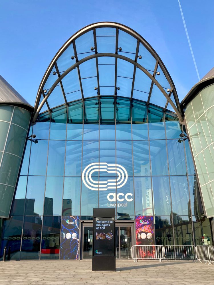 Entrance of the conference venue, ACC Liverpool, with the Biologists @ 100 logo.