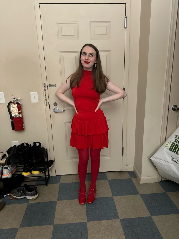 girl with brown hair wearing an all red monochrome outfit 