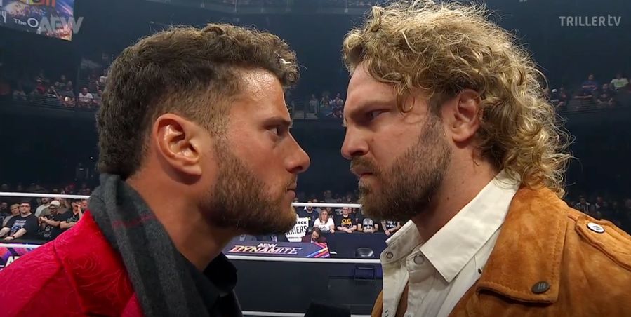 MJF facing off with Hangman Adam Page from Dynamite. Their faces are very close and they're glaring at one another, but Hangman's not leaning in to do that angry nuzzle thing he sometimes does when the feud is sexually charged.