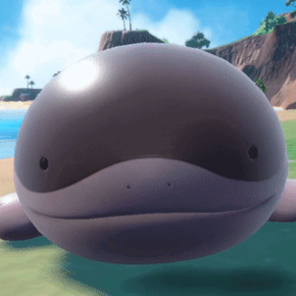 a whale with a hole in its mouth is laying on the grass