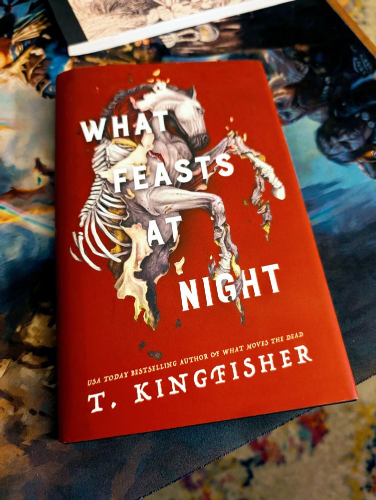 A copy of the book What Feasts At Night.