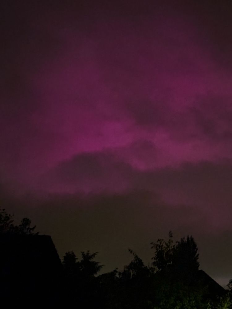 Pink-purple sky at night over Basel, Switzerland.