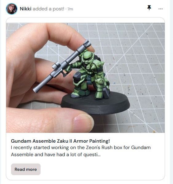 Screenshot of a Ko-Fi post for paint workup of a Zaku II from Gundam Assemble. Miniature is green and painted in a cel-shaded style