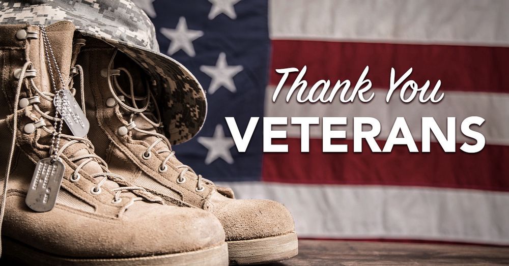 Picture of military boots, militarily dog tags, military hat, and our national flag. 