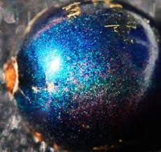 an iridescent blue sparkling berry