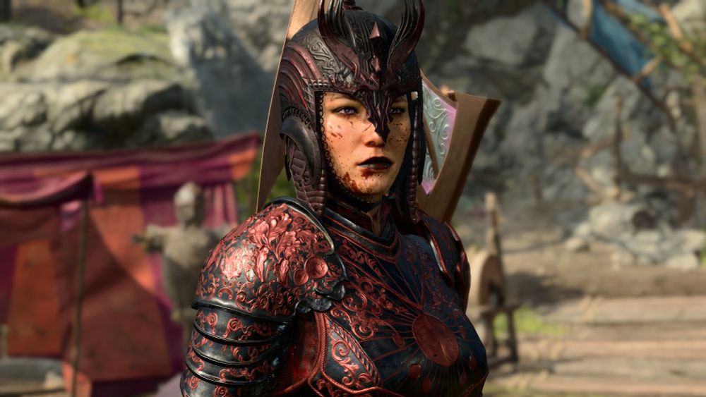 Medium shot of Alywyll in the Act 1 camp, some blood splattered onto her face.