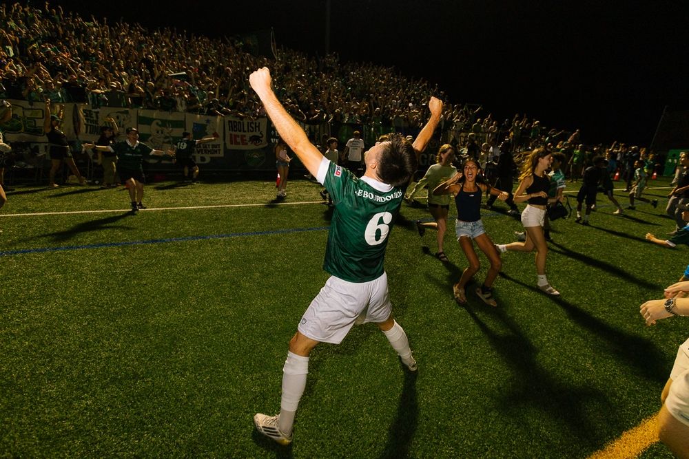 Julien Le Bourdoulous celebrating the win following penalty kicks at Virtue Stadium, to the left: me losing my goddamn mind