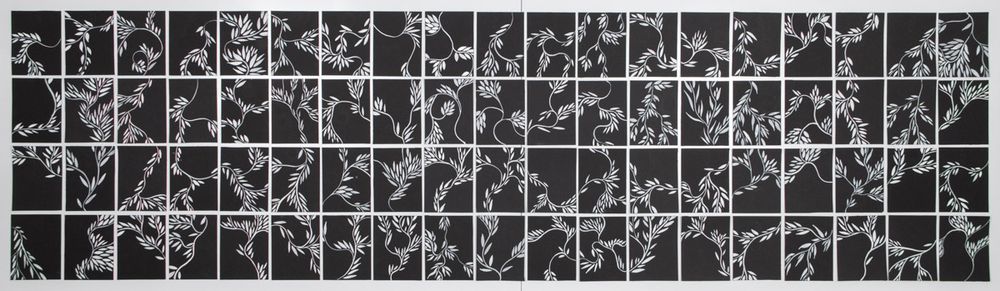 An installation of 4 rows of 19 black paper rectangles, each with a painted pattern of white stylized lines and leaves. They are assembled so that the pattern in each rectangle connects to the pattern in the ones around it creating an overall flow and design. 