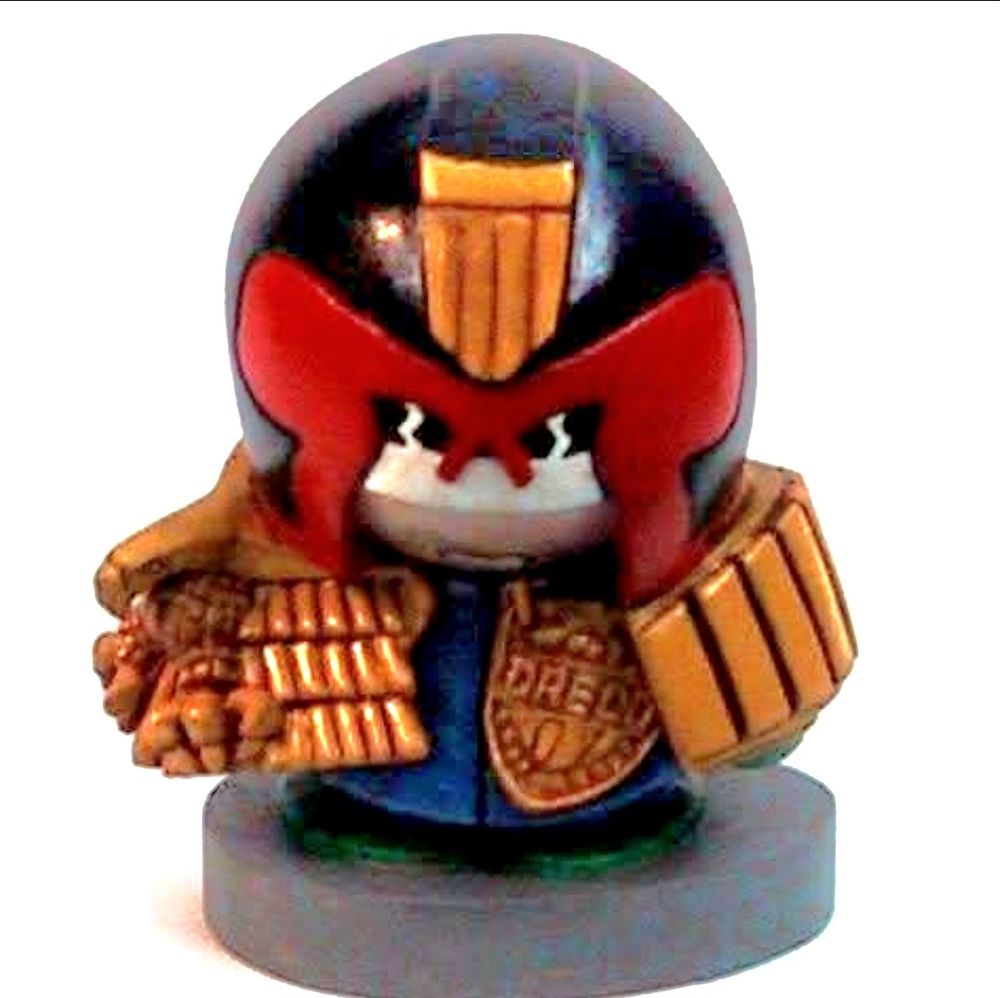 model of a giant ball-headed Judge Dredd whose shoulder pads are almost 50% of his body volume.