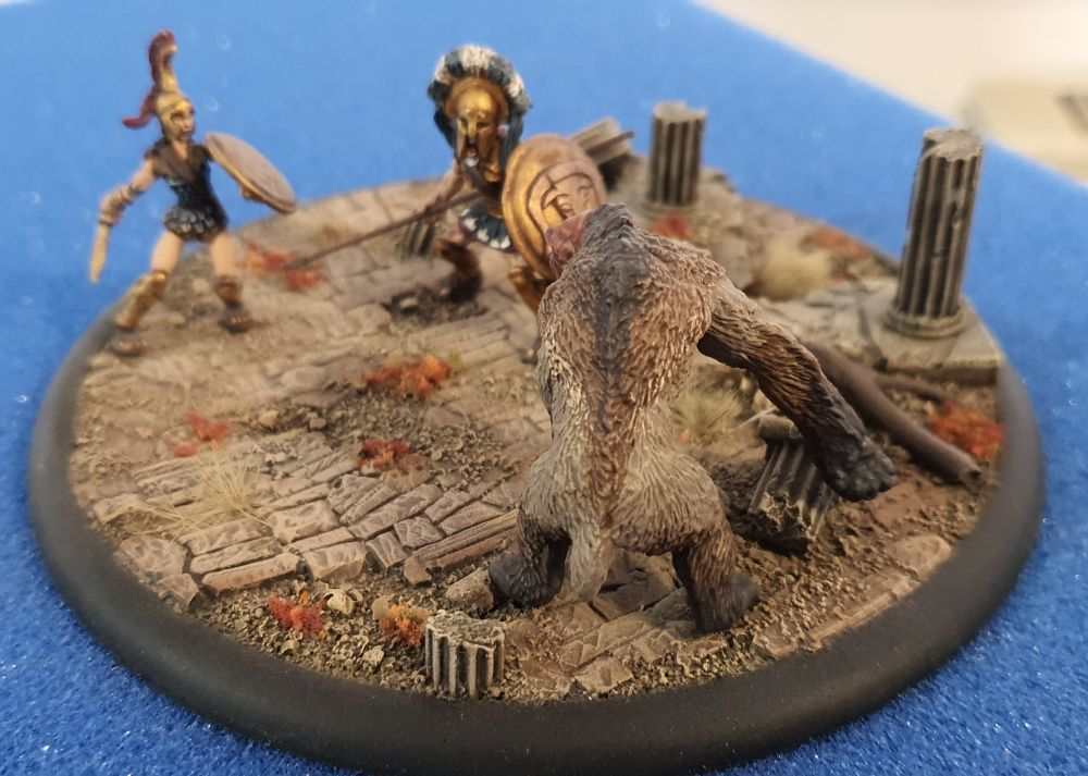 View of the same diorama seen from behind the pumpkin bear and towards the two humans.