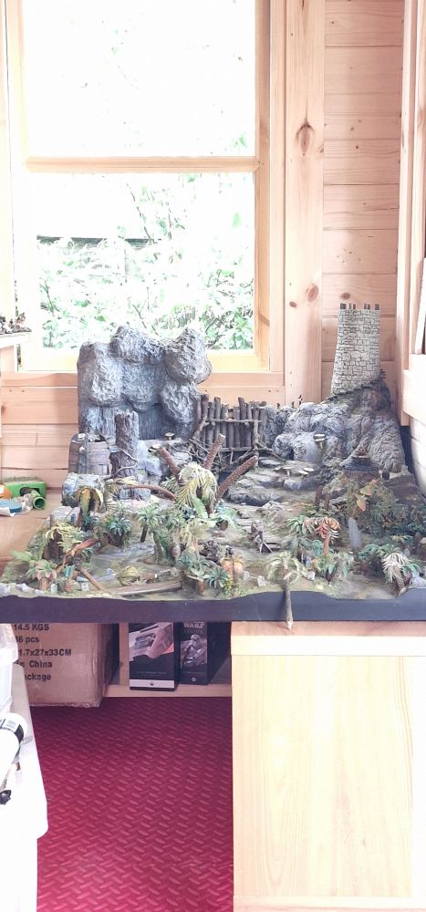 games board tucked away in the corner of s wooden cabin.