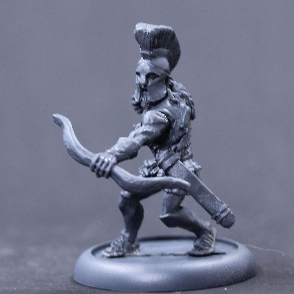 Greek adventurer with bow held ready.