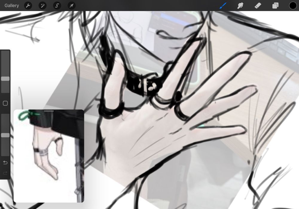 A rough sketch of a hand with low-opacity picture of my own hand underneath