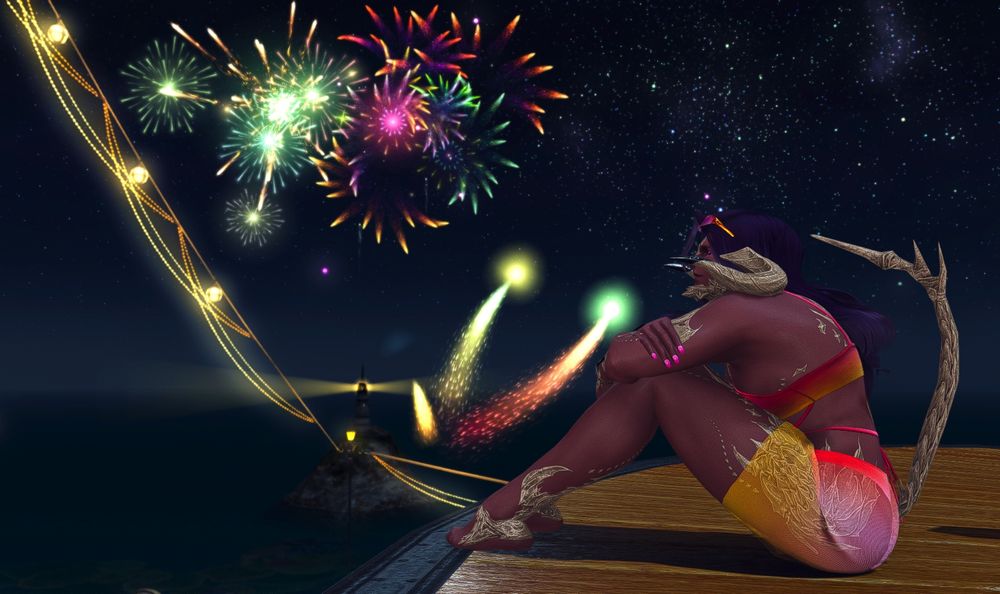 Khepri, wearing a pink two piece swimsuit, watching the fireworks. 