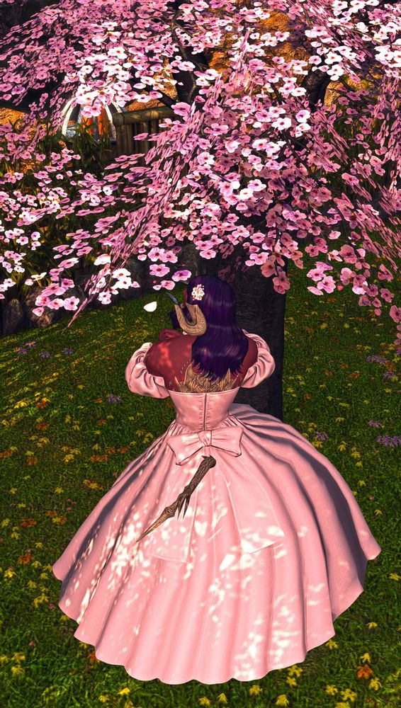 Khepri twirling under a chair blossom tree. His back is to the camera and he's wearing an off the shoulder pink dress. 