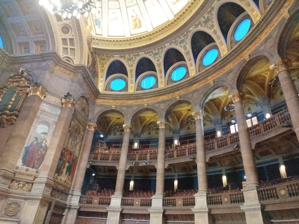 A view of the upper galleries of the lecture hall, with lots of fancy archways 