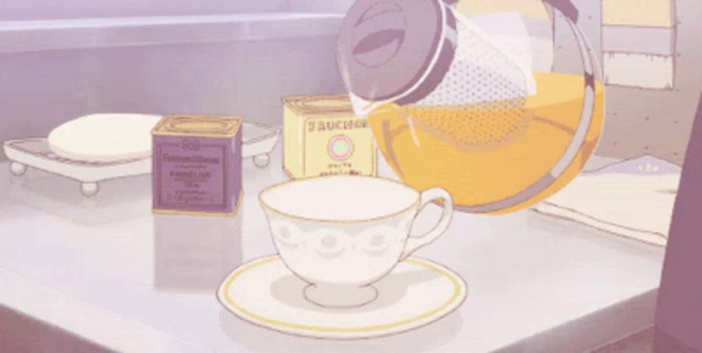 a cartoon drawing of a cup of tea and a box of tea