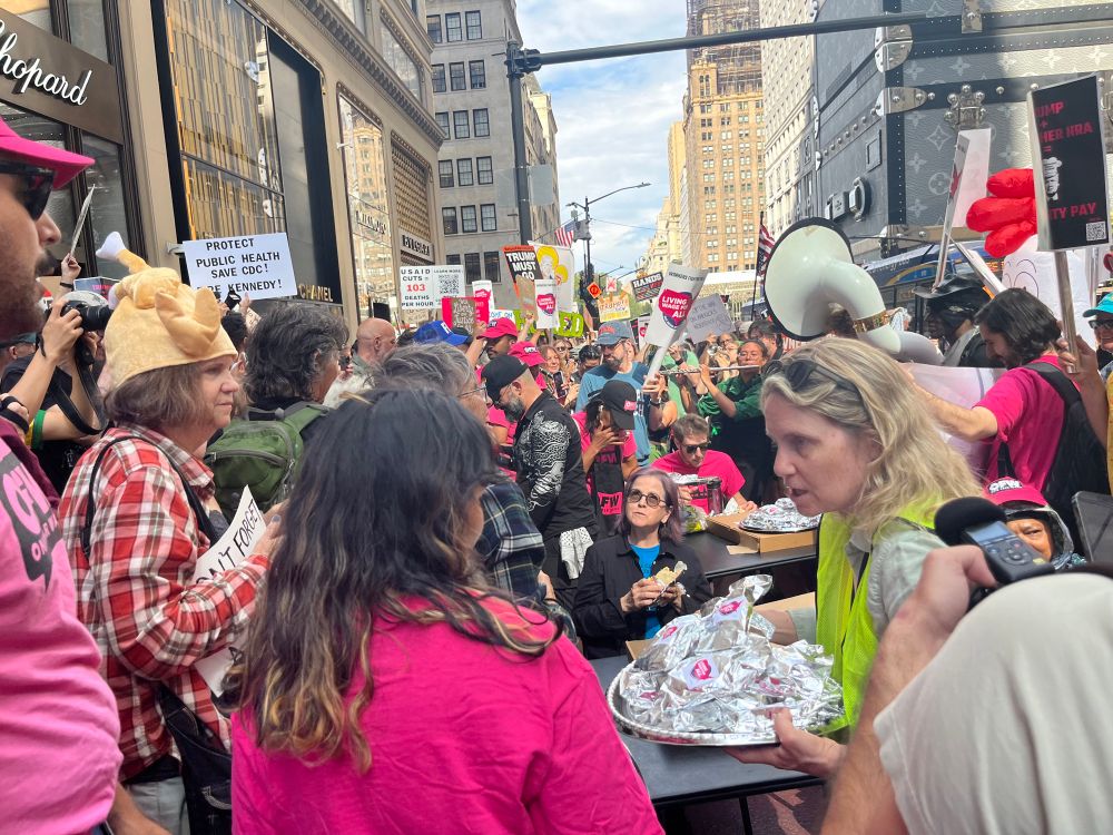 Trump Tower, NYC, Workers over Billionaires protest. Handing out free tacos, lady wearing a chicken hat
