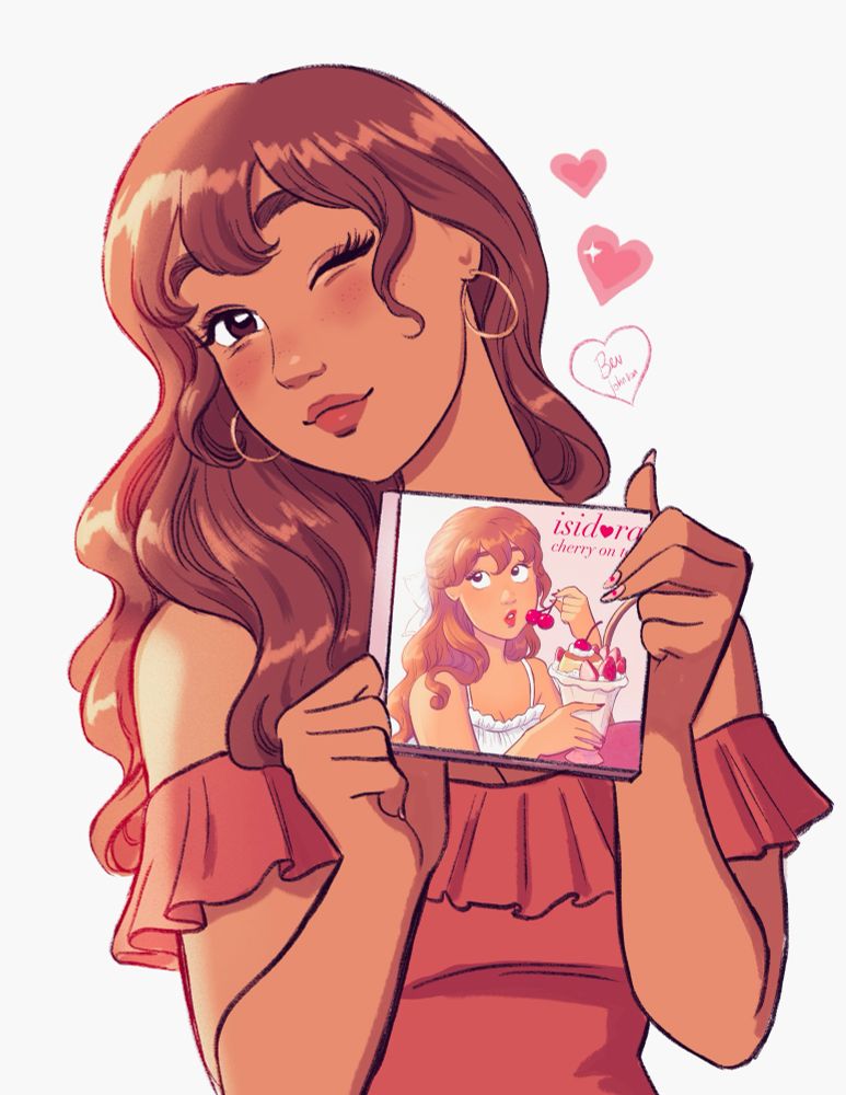 Isi holding up a “Cherry On Top” CD