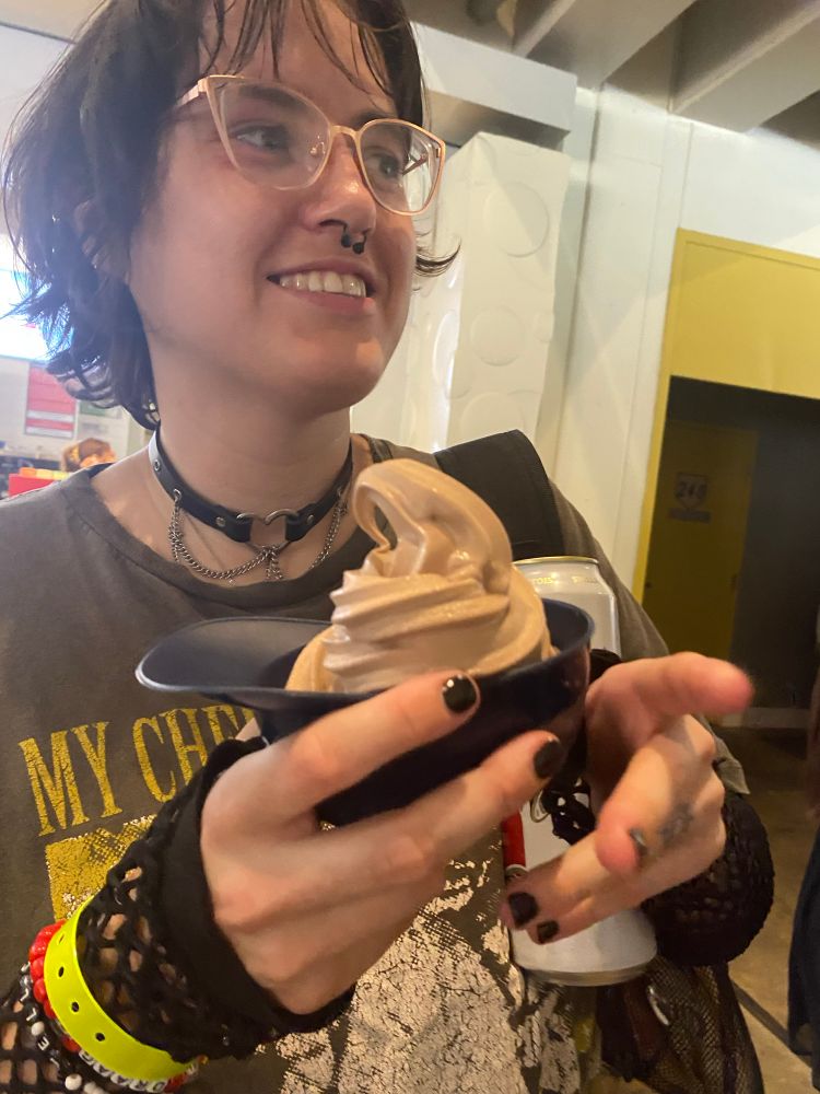 my wife holding choco soft serve in a
baseball cap shaped thing 