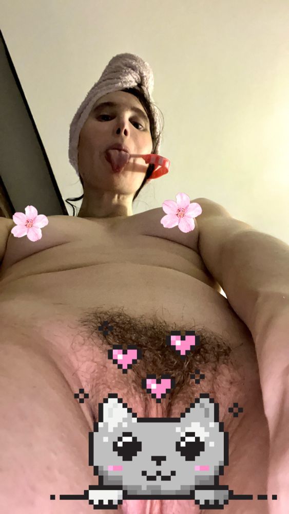 Naked selfie with private part hidden with a cute cate and cherry flowers