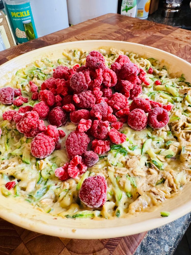 Bowl of oats with raspberries on top 