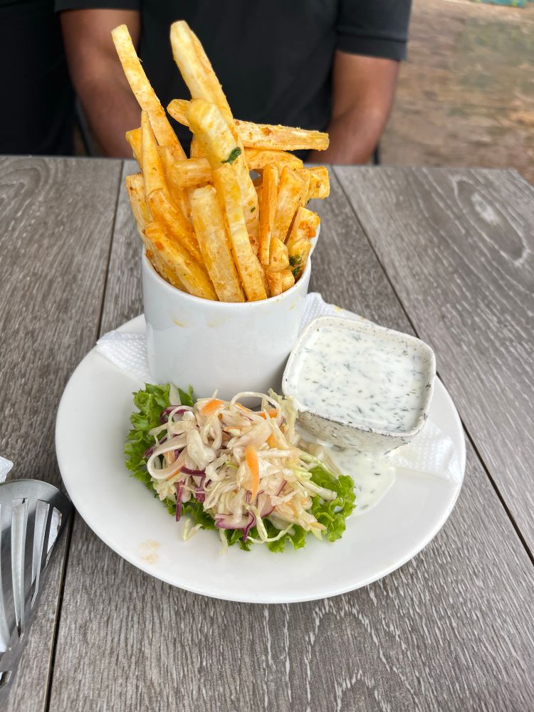 Cassava cut into shape of fries with coleslaw in the side