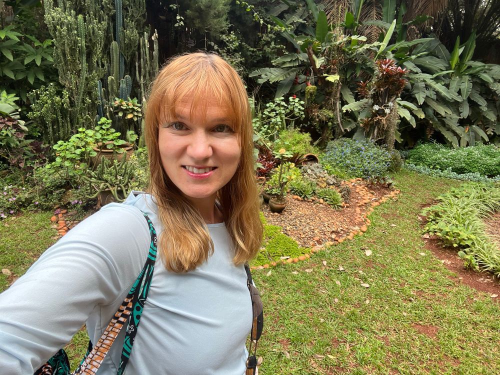 Selfie of OP in front of tropical garden