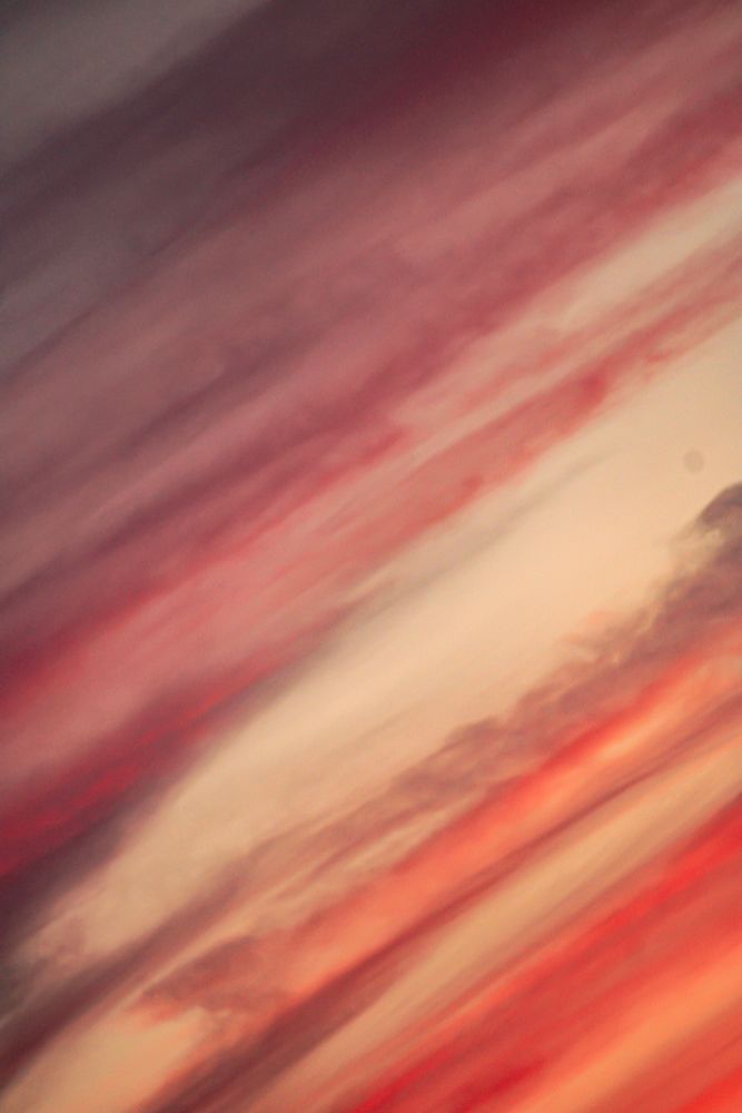 A vibrant sunset in lines of red and mauve - taken at an angle for a more abstract look.  The red sunsets are what I'm happy and grateful to see again- feels like it's been a while 