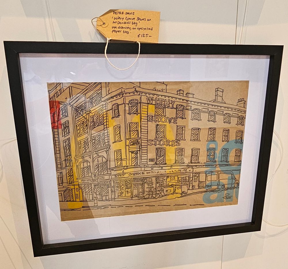 A detailed, framed, drawing of a building.